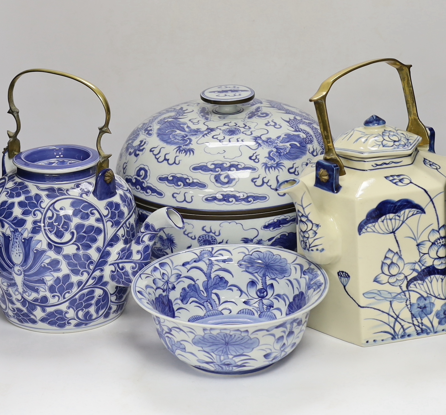 Four modern Chinese blue and white ceramic items; two teapots, a lidded vessel and a bowl, tallest 23.5cm